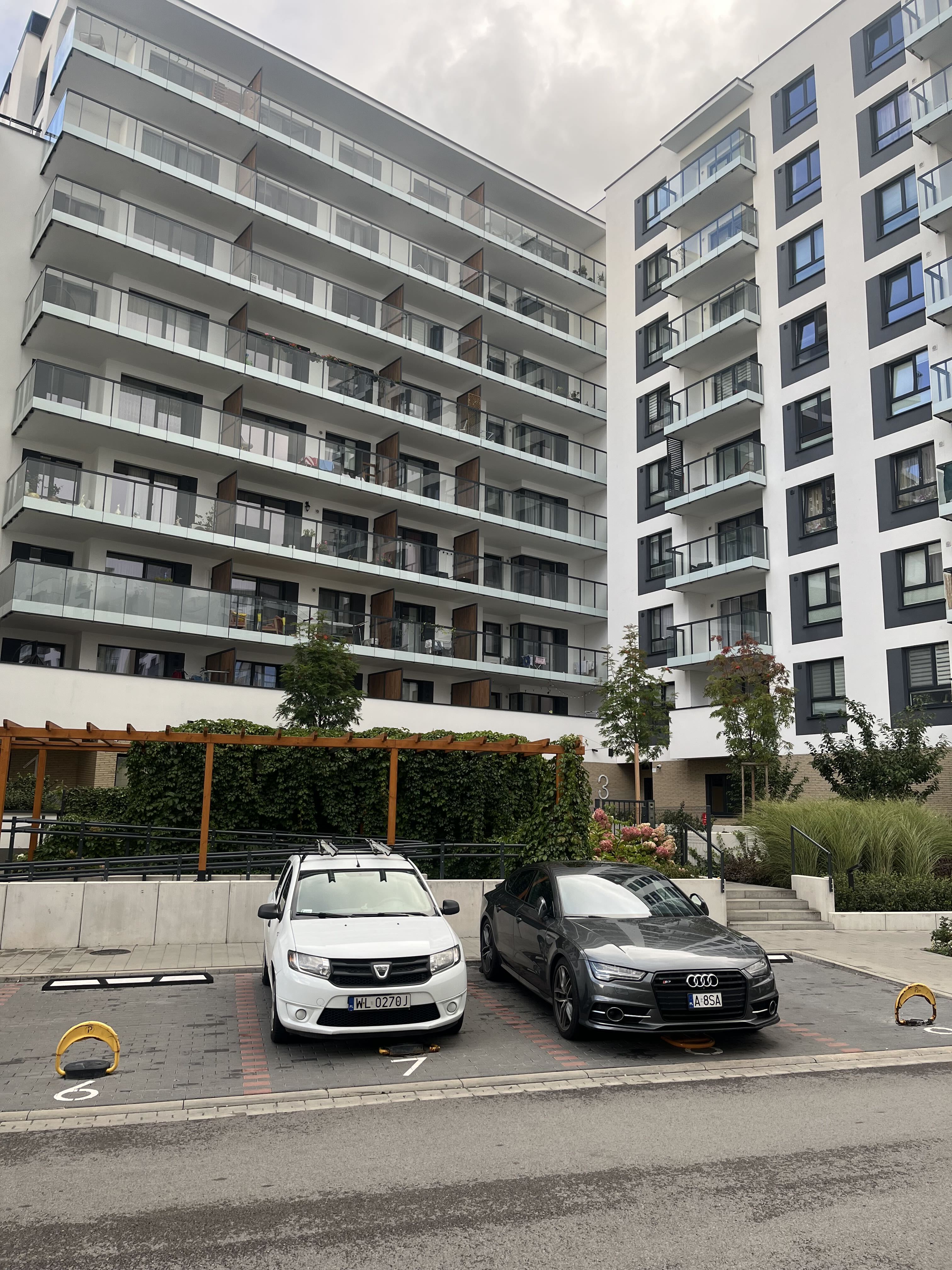 Surface parking next to a Metro Zachód residential building