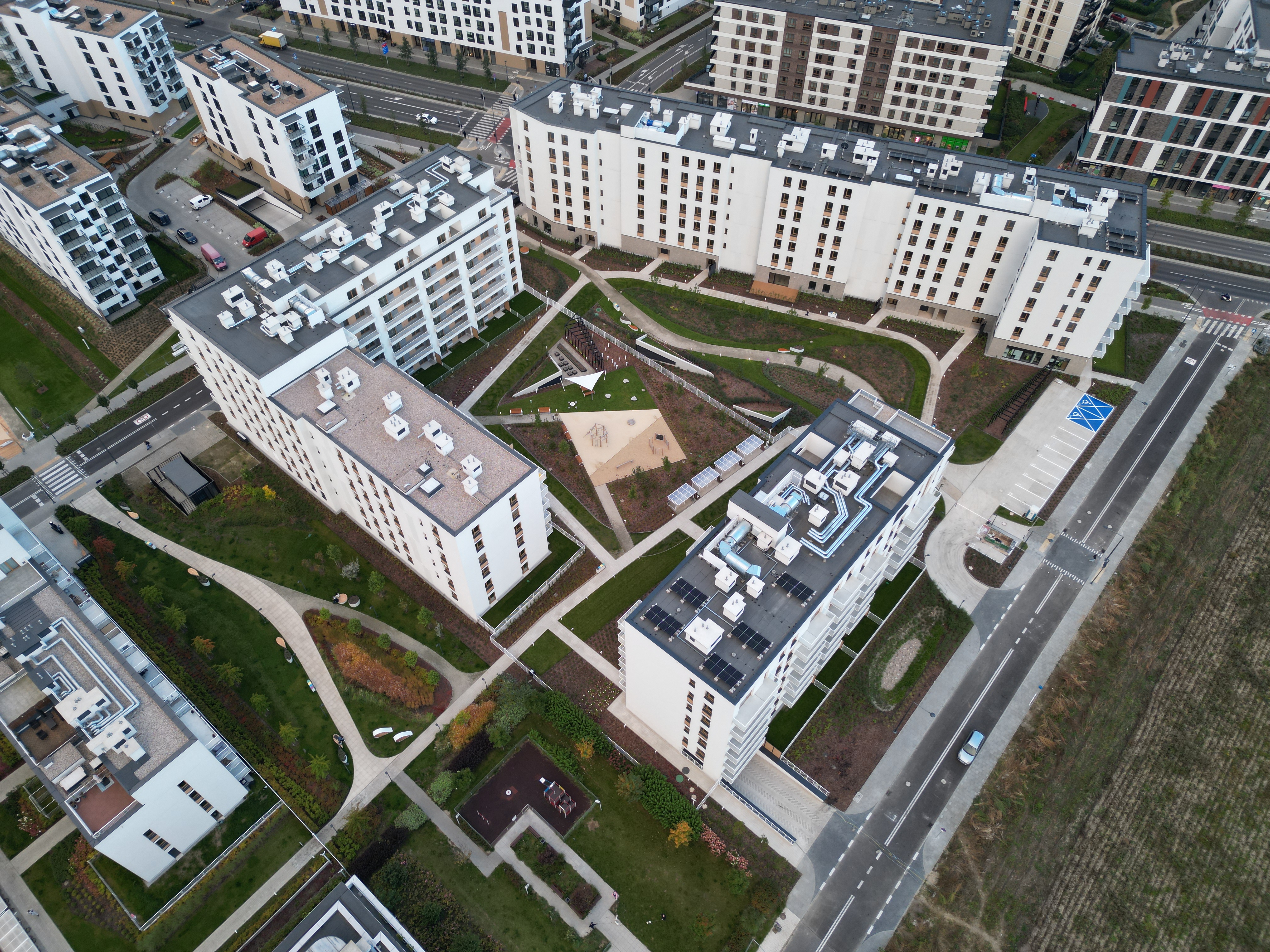 Aerial of Neowo stage two with car-free courtyard and playground