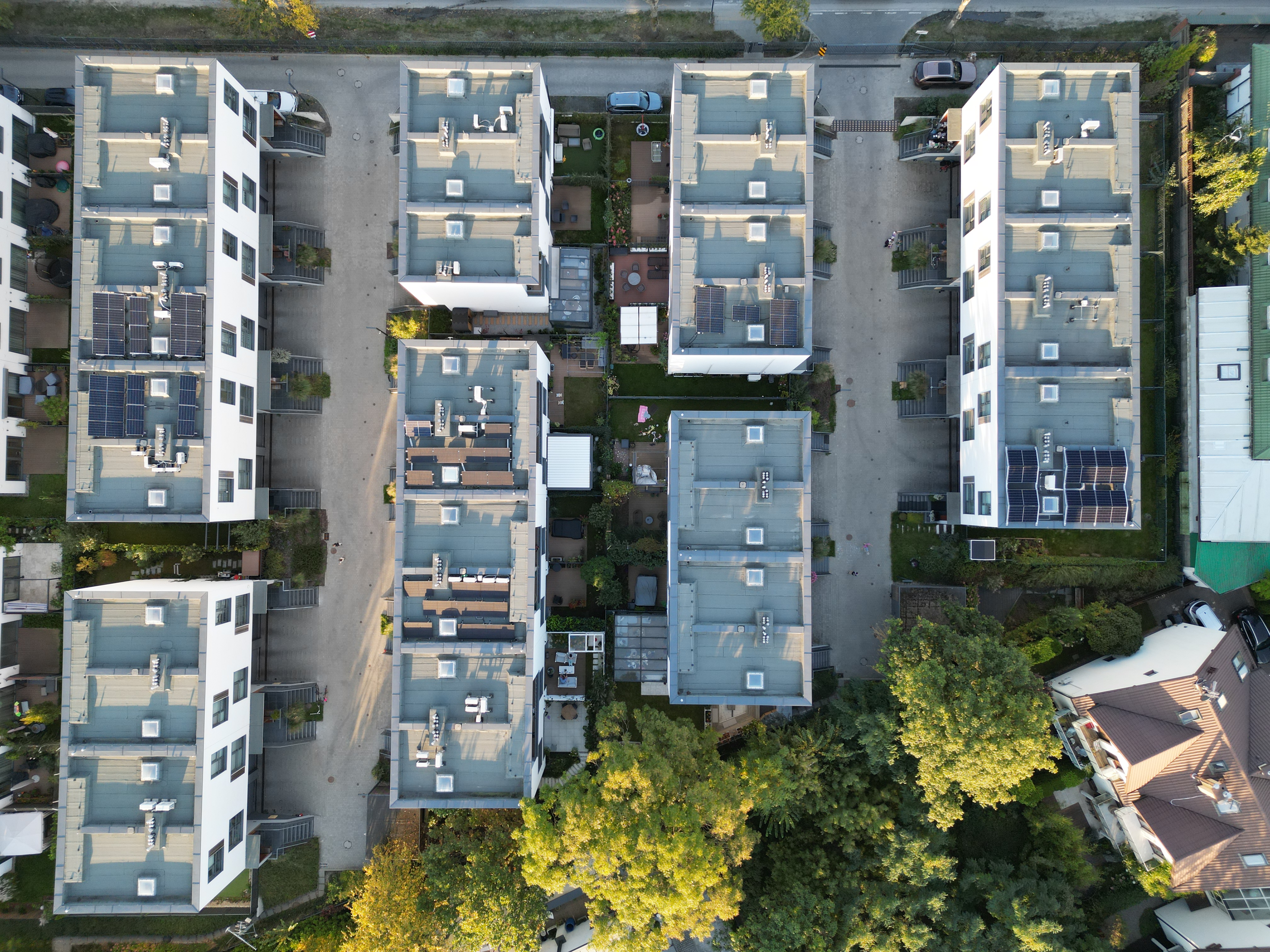 Drone view of Villa De Charme roofs, solar panels and private gardens