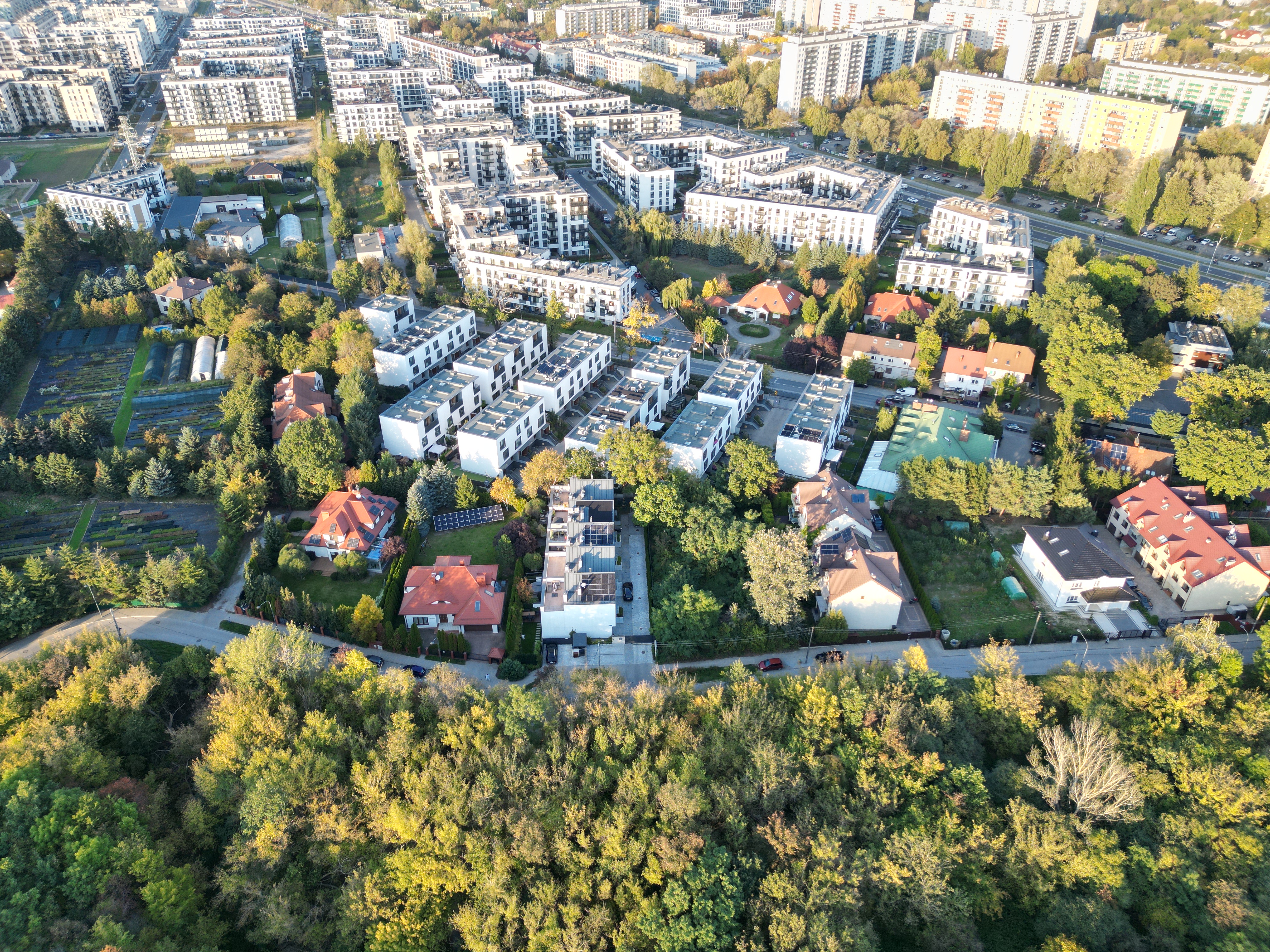 Aerial panorama of Villa De Charme among older houses and trees on Szeligowska